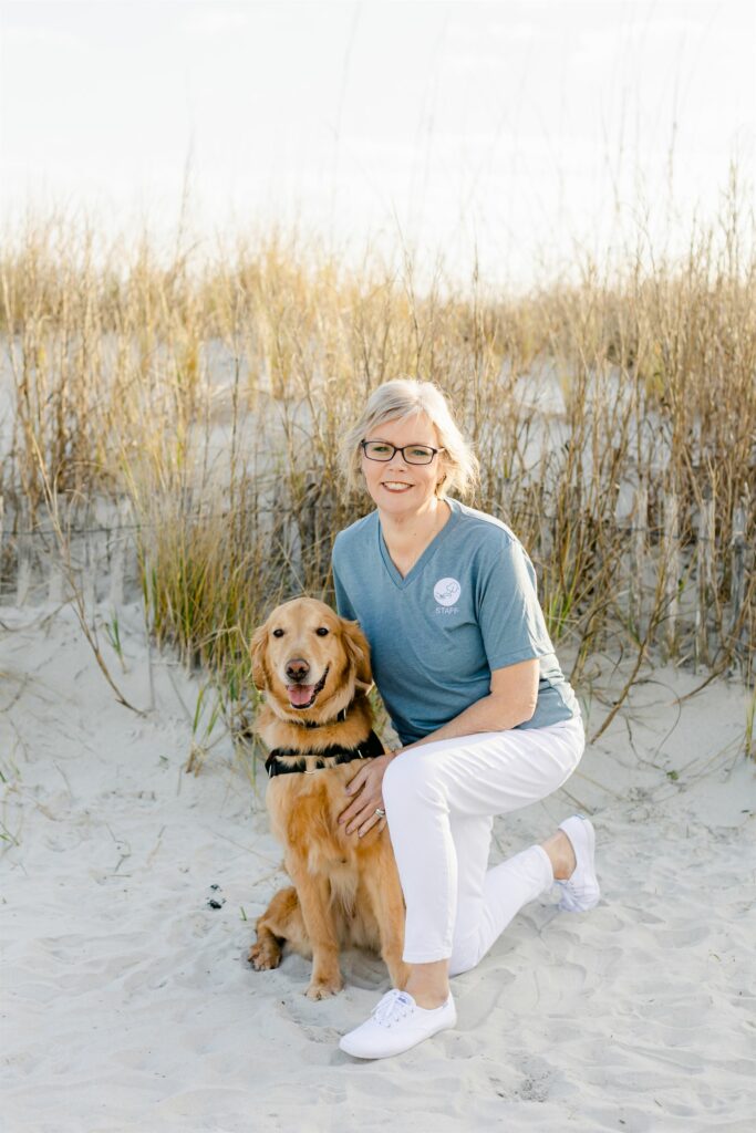 paws4people team member Cece McConnell with golden retriever in service dog vest